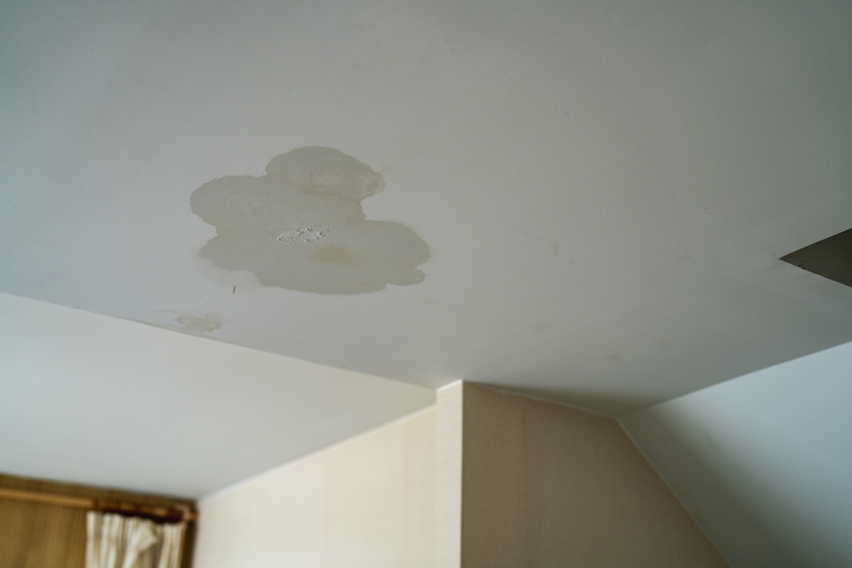 Water stain on a ceiling caused by an upstairs leak